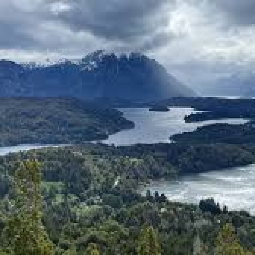 Group of backpackers hiking along a mountain trail.